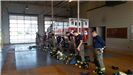 Firefighters Standing in a Formation Putting on Their Gear in a Fire House