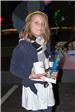 Child Holding a Mug and Trophy with a Glow Headband