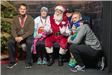 A Group Posing with Santa Claus