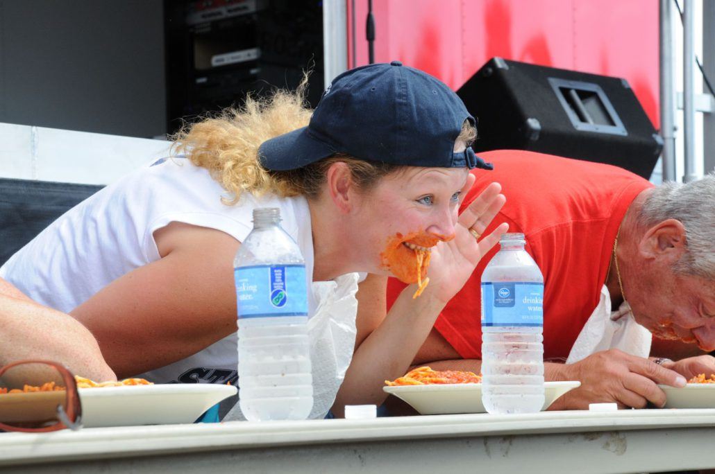 Woman Looking up from Her Plate at the Spaghetti Eating Contest